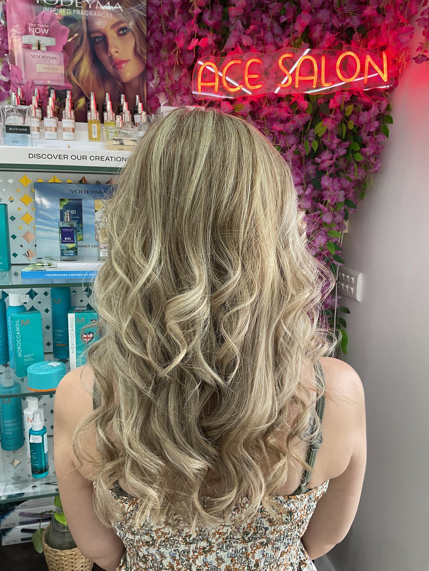 Icy blonde balayage curls at ACE